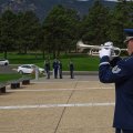 Bugler playing Taps, Firing party at attention