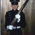 Parade uniform at port arms with M-1