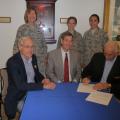 Jim Diffendorfer, Gen Steve Lorenz and Mick Roth sign the 1963 Endowment Agreement in 2011